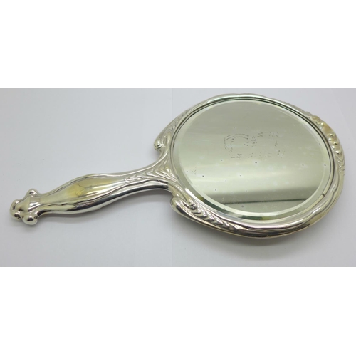 853 - An Art Nouveau silver backed hand mirror, Birmingham 1908, Thomas Bishton, a/f