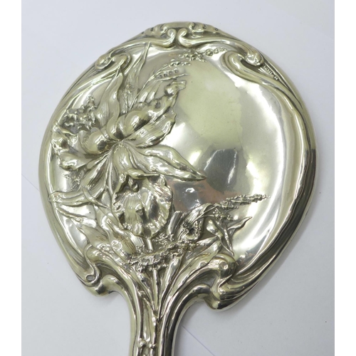 853 - An Art Nouveau silver backed hand mirror, Birmingham 1908, Thomas Bishton, a/f