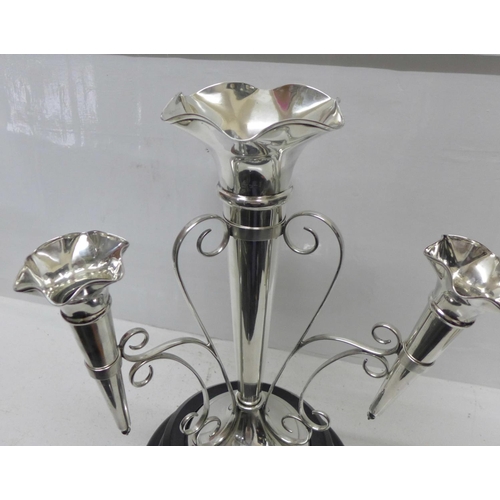 865 - A silver four trumpet epergne, Walker & Hall, Sheffield 1930, 1382g, 44oz., weighted base, height 35... 