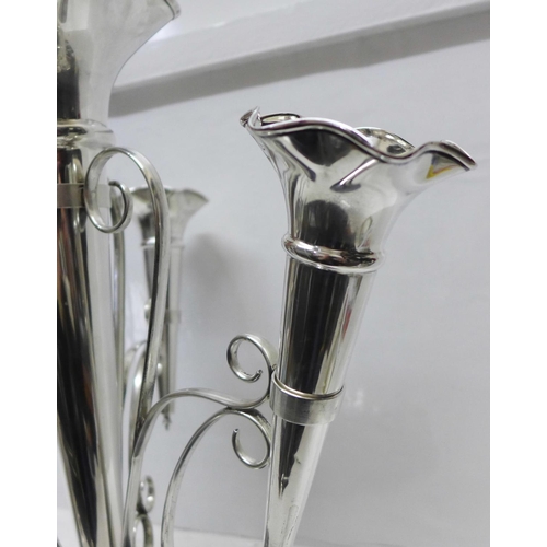 865 - A silver four trumpet epergne, Walker & Hall, Sheffield 1930, 1382g, 44oz., weighted base, height 35... 