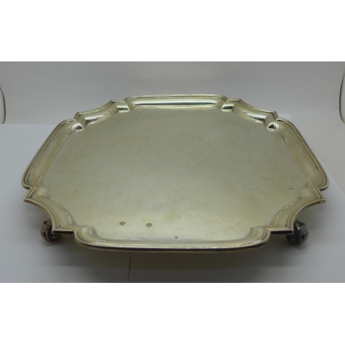 866 - A silver tray on four feet, Birmingham 1948, with inscription dated 1955, 1019g, 32.5oz., 29.5cm