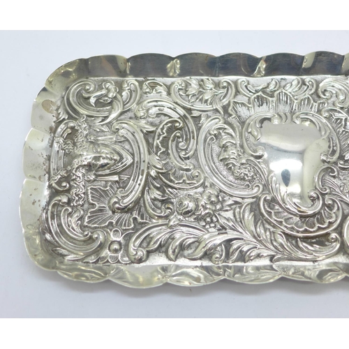 874 - An embossed silver tray, London 1900, William Comyns, 127g, 10.5cm x 24cm