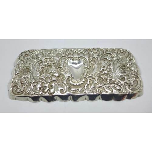 874 - An embossed silver tray, London 1900, William Comyns, 127g, 10.5cm x 24cm