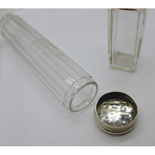 882 - A silver topped glass scent bottle and two silver topped glass bottles, glass chipped on rim of one ... 