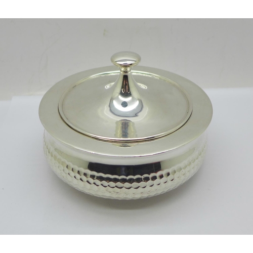 883 - A hammered silver pot with lid, marked '935 silver', 285g