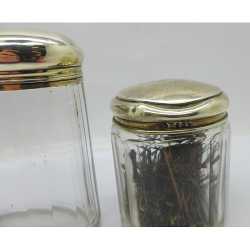 887 - Three silver topped glass jars including one Victorian, 64g of silver, tops dented