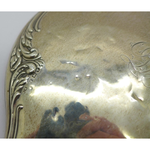 889 - A silver backed hand mirror, silver dented