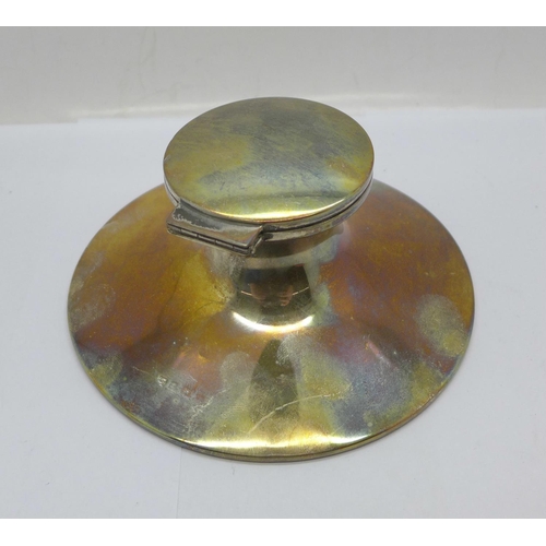 890 - A silver inkwell, hallmark worn, no liner, diameter of base 14cm