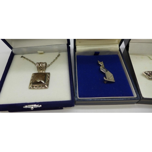 903 - A silver and smoky quartz pendant and chain, an Art Deco style cat brooch and a silver butterfly bro... 