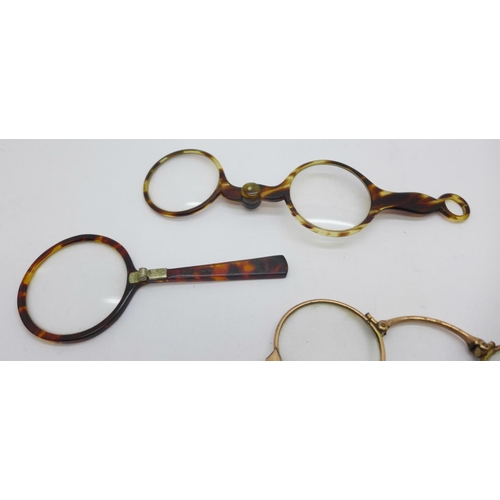 910 - Two pairs of lorgnettes including one gold plated and a folding eyeglass