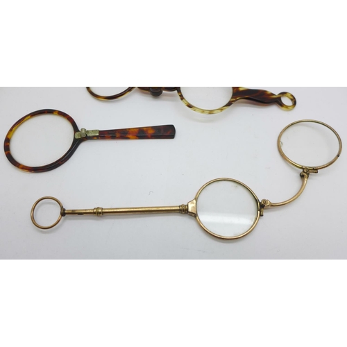 910 - Two pairs of lorgnettes including one gold plated and a folding eyeglass