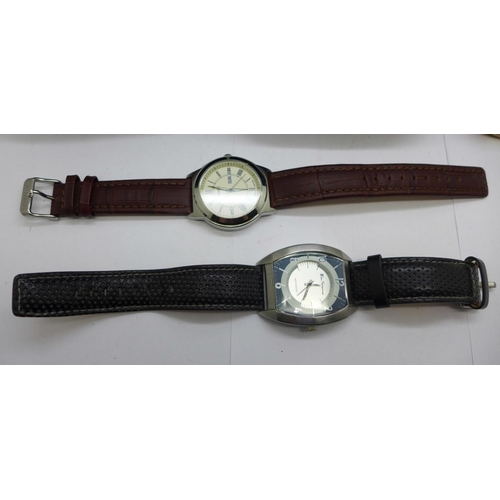 938 - Three wristwatches and two Rado travel pouches