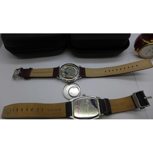 938 - Three wristwatches and two Rado travel pouches