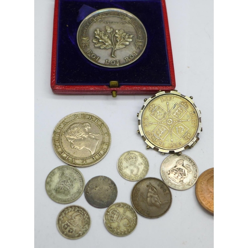 939 - A collection of British and foreign coins, etc., including a Queen Victoria 1900 South Notts Hussars... 