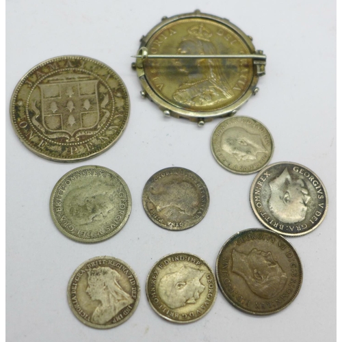 939 - A collection of British and foreign coins, etc., including a Queen Victoria 1900 South Notts Hussars... 