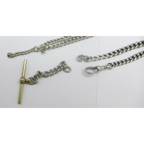 950 - A silver Albert chain with graduated links, one other silver Albert, one clip a/f, and a base metal ... 