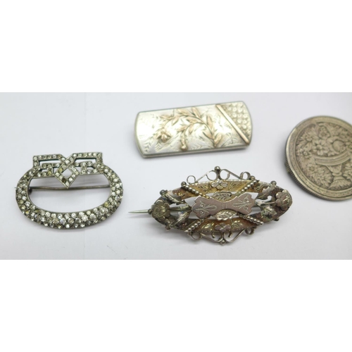 973 - Four brooches;- one Victorian hallmarked silver, one mounted Victorian coin, one with gold applied d... 