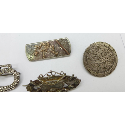 973 - Four brooches;- one Victorian hallmarked silver, one mounted Victorian coin, one with gold applied d... 