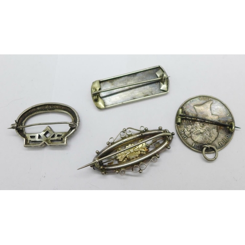 973 - Four brooches;- one Victorian hallmarked silver, one mounted Victorian coin, one with gold applied d... 