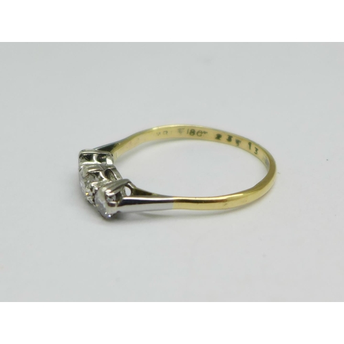 978 - An 18ct gold, three stone diamond trilogy ring, approximately 0.90 carat diamond weight, 2.9g, V