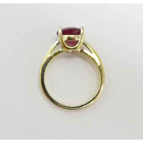 981 - A silver gilt and ruby solitaire ring, N