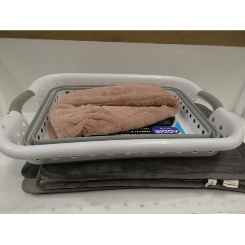 3146 - Two bath mats, laundry basket and hot water bottle (225) * This lot is subject to VAT