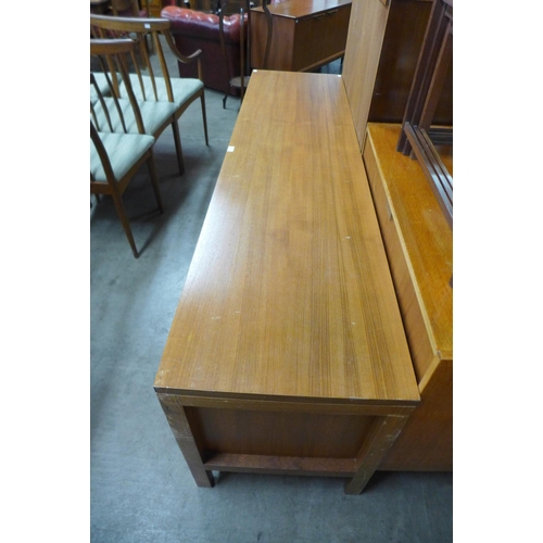 116 - A teak sliding two door sideboard