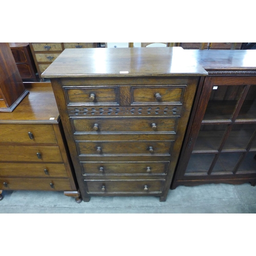 122 - A carved Ipswich oak chest of drawers