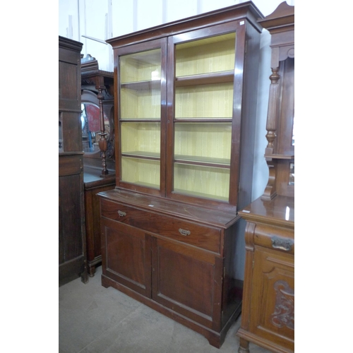 141 - A Victorian mahogany bookcase (lacking one glass pane to door)