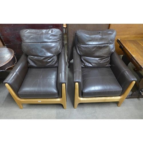 152 - A pair of ash and chocolate leather armchairs