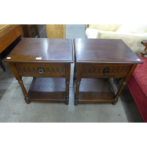 154 - A pair of carved oak bedside tables