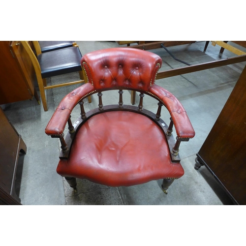 157 - A Victorian style mahogany and upholstered tub chair