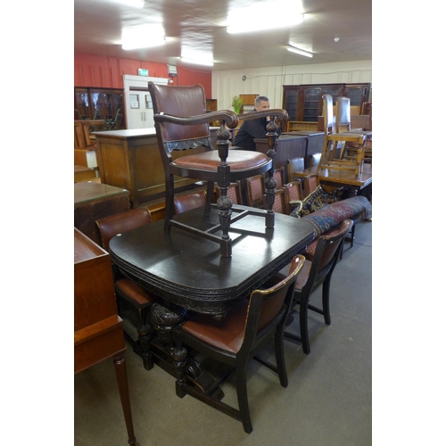 161 - A carved oak seven piece dining suite