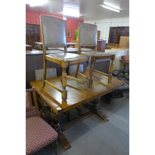 164 - A 17th Century style Ipswich oak draw-leaf refectory table and four dining chairs