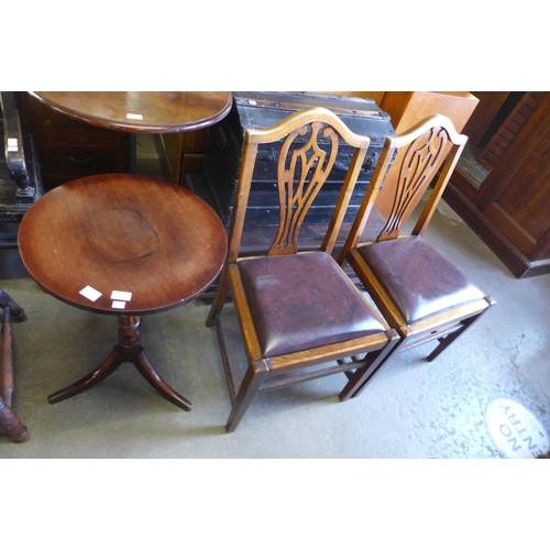 173 - A Victorian Cuban mahogany reeded circular tripod table and a pair of mahogany chairs