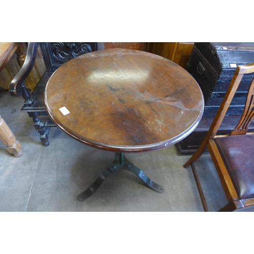 174 - A mahogany and wrought steel based pub table