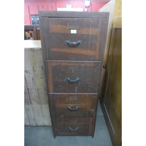 175 - An oak filing cabinet