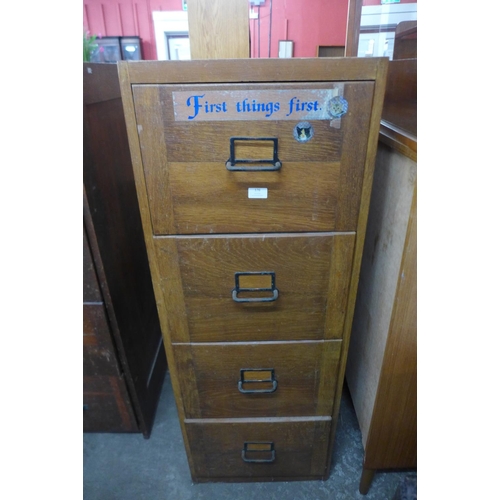 176 - An oak filing cabinet