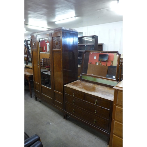 190 - A carved oak two piece bedroom suite