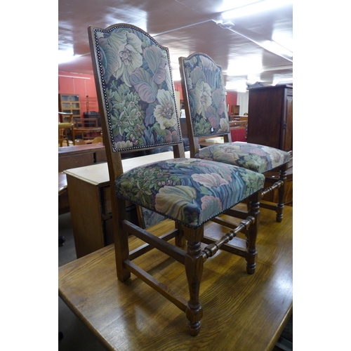 197 - An 18th Century style oak refectory table and four chairs