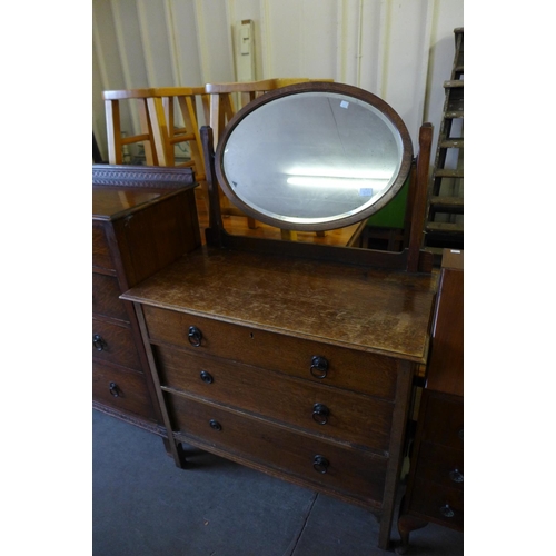 219 - Two oak chests of drawers and a dressing chest