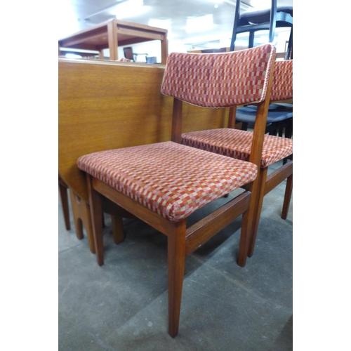 87 - A teak drop leaf table and four chairs