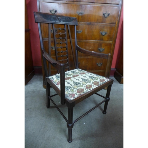 77 - An Arts and Crafts mahogany elbow chair