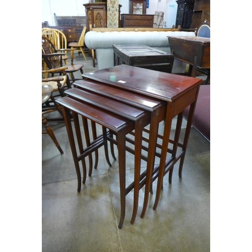 79 - An Edward VII inlaid mahogany nest of quartetto tables