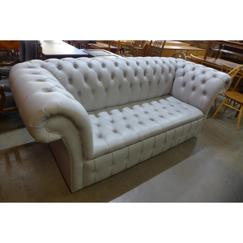 82 - A duck egg blue leather Chesterfield settee