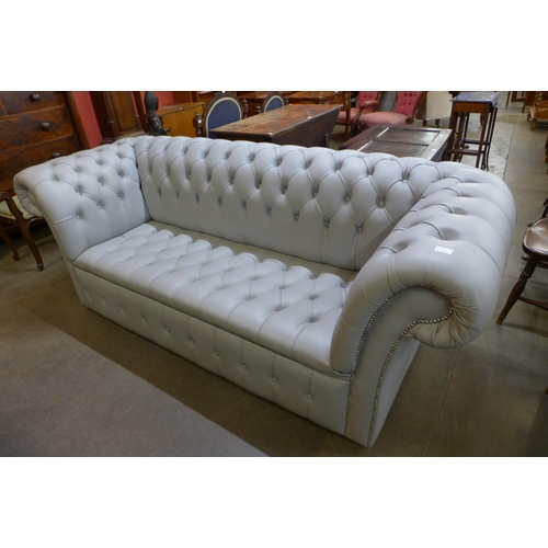 82 - A duck egg blue leather Chesterfield settee
