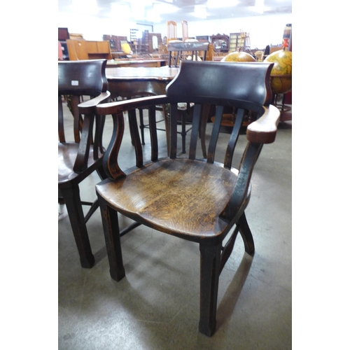 87 - A pair of early 20th Century oak office desk chairs
