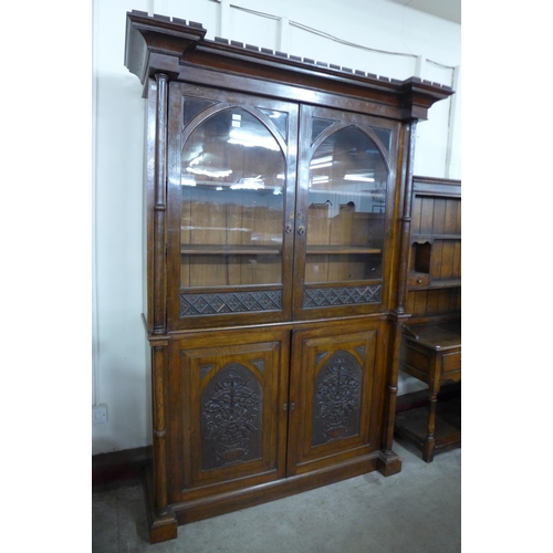 94 - A Victorian Gothic Revival carved oak bookcase, manner of A.W.N. Pugin