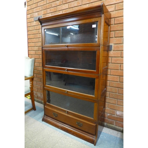 97 - An early 20th Century mahogany four tier sectional stacking bookcase