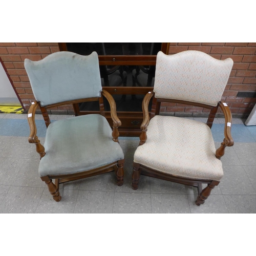 98 - A pair of walnut and upholstered open armchairs